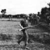 Marines from Company E, 2d Battalion, 4th Marines move out from LZ WHITE during Operation STARLITE. Shortly after this picture was taken, the company met stiff resistance from Viet Cong entrenched to the right of the photograph. (USMC Photo A 184946)